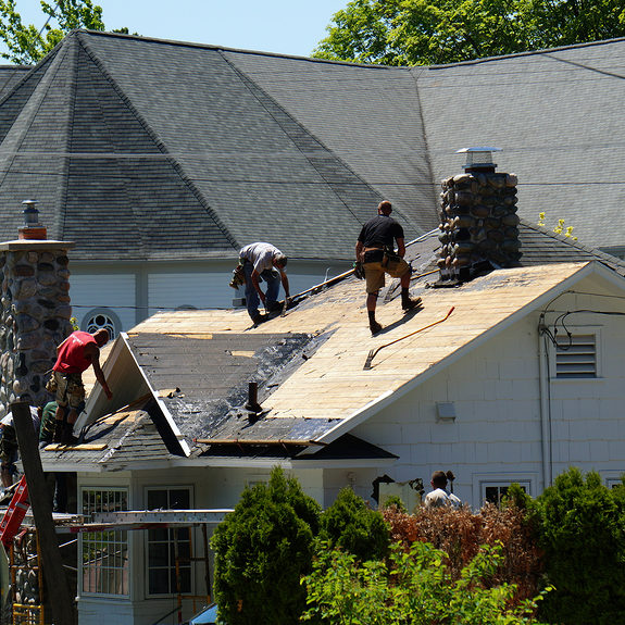 workers fixing the roof