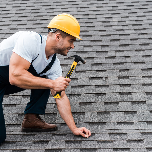 worker using a hammer