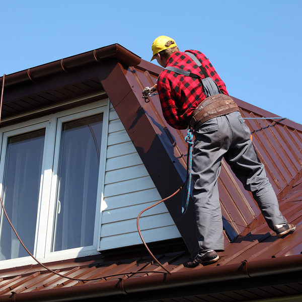 worker checking the roof